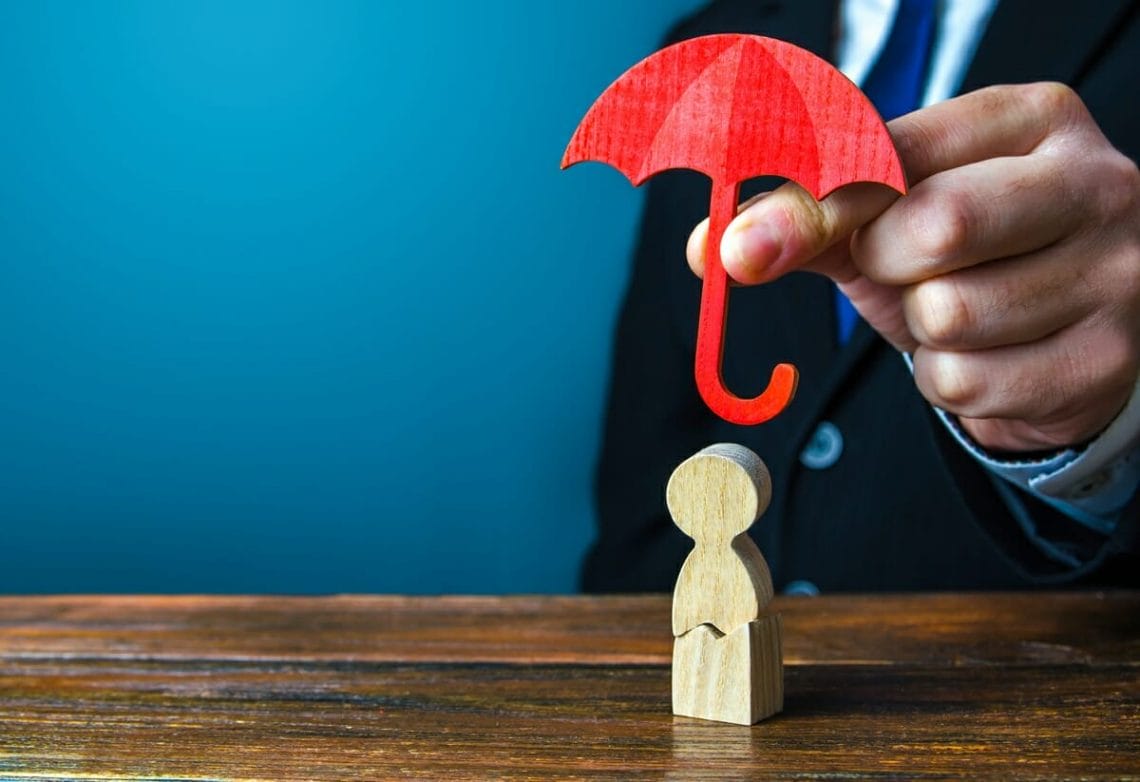 insurance agent holds an umbrella over a men with 2022 11 09 06 40 53 utc